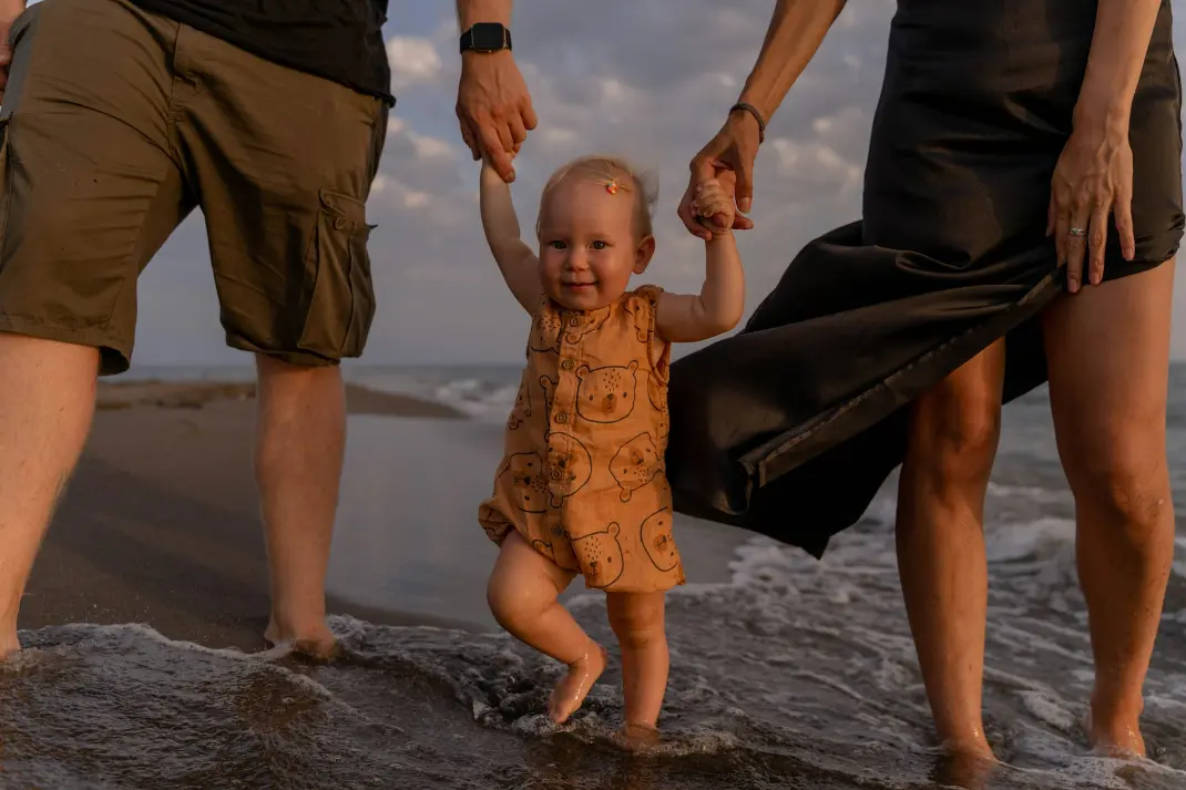 a baby being held by a person